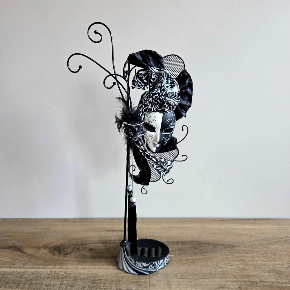 Decorative jewelry stand/holder with Venetian mask design.